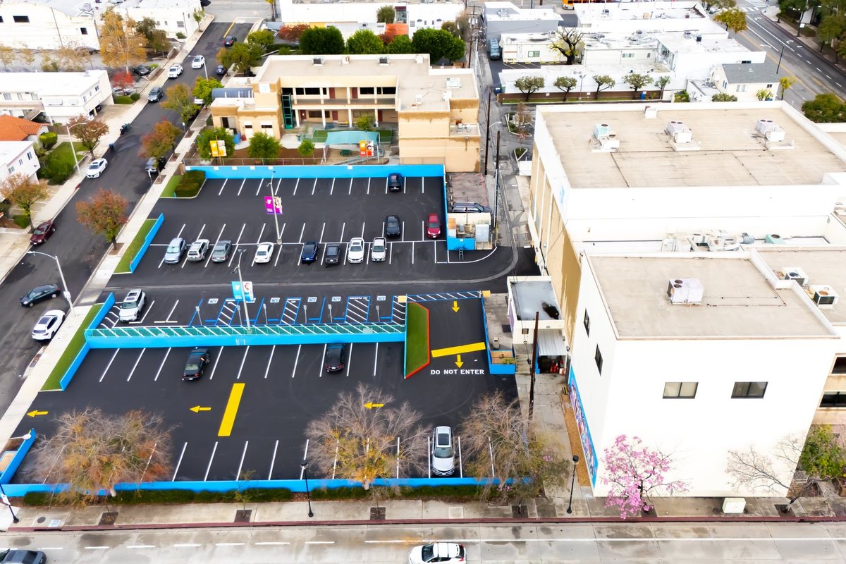 Commercial parking lot with ADA accessible stalls and blue striping